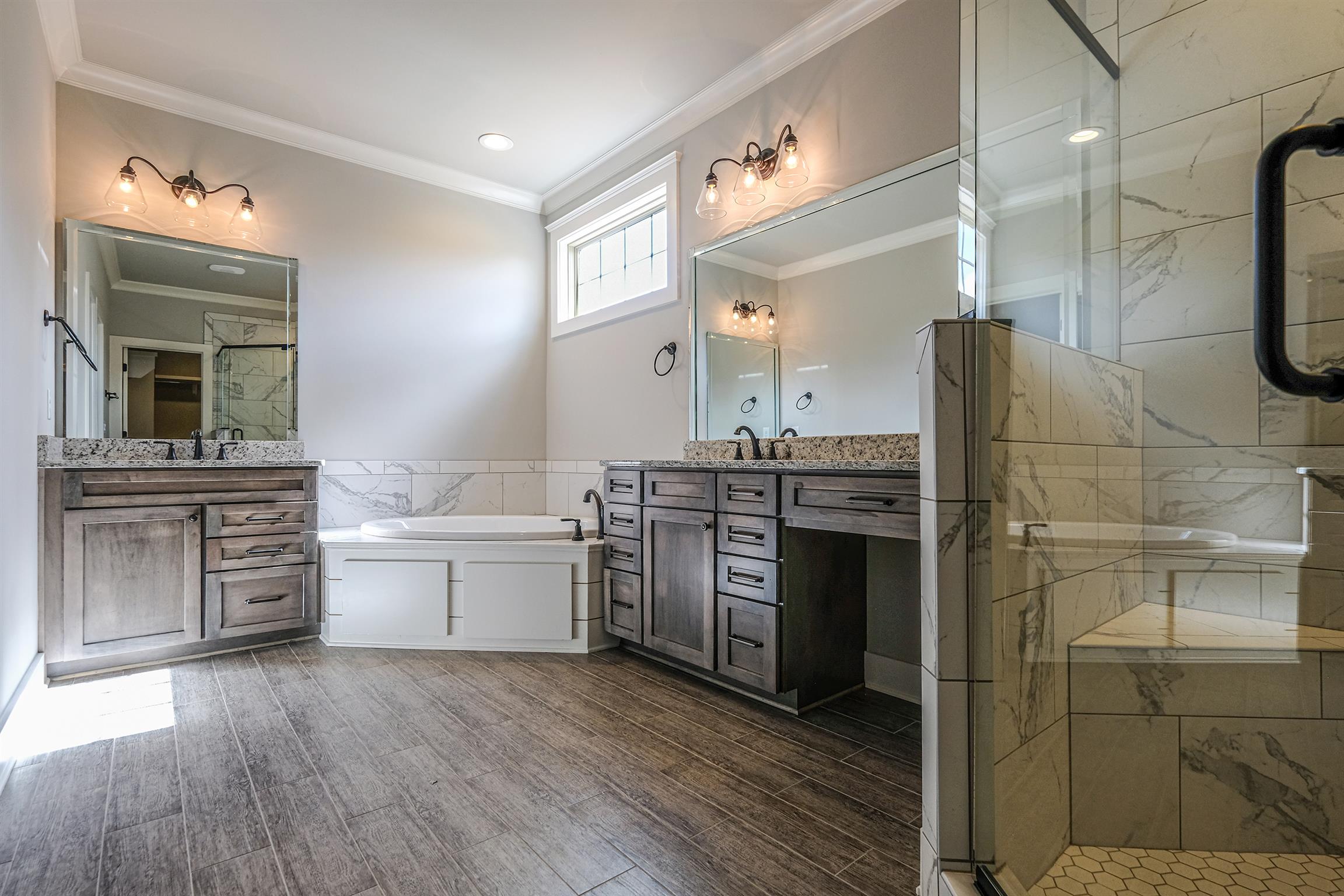 2034 Autumn Ridge Way Spring Hill, TN 37174 - Photo 16 of 30 Master bathroom includes double vanities, corner soaking tub and oversized shower.