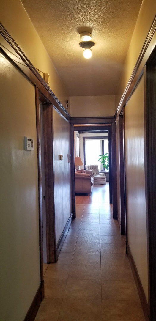 7418 South Rhodes Avenue Chicago, IL 60619 - Photo 14 of 41 a view of gallery with wooden floor