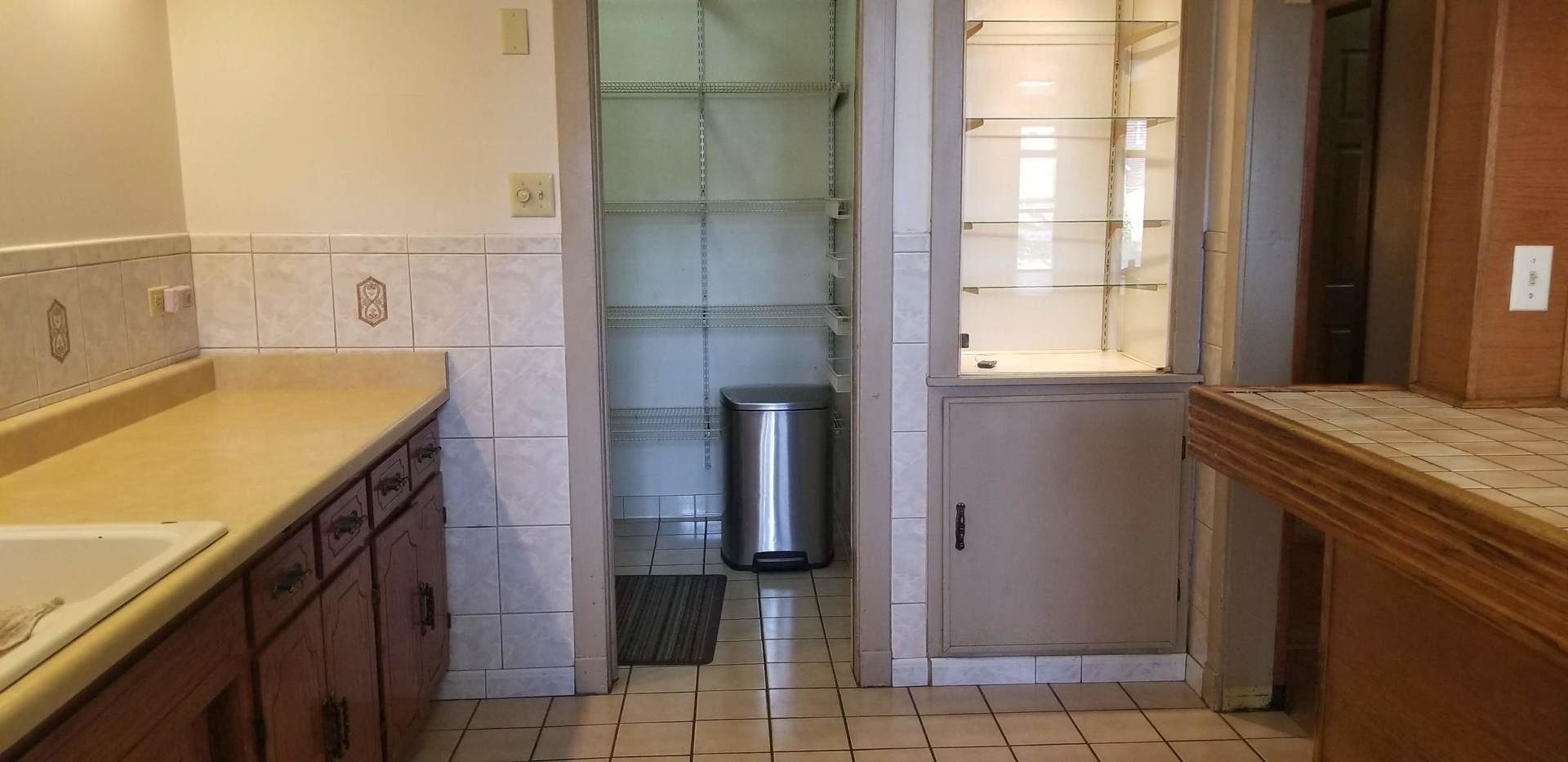 7418 South Rhodes Avenue Chicago, IL 60619 - Photo 16 of 41 a bathroom with a granite countertop sink a toilet and shower