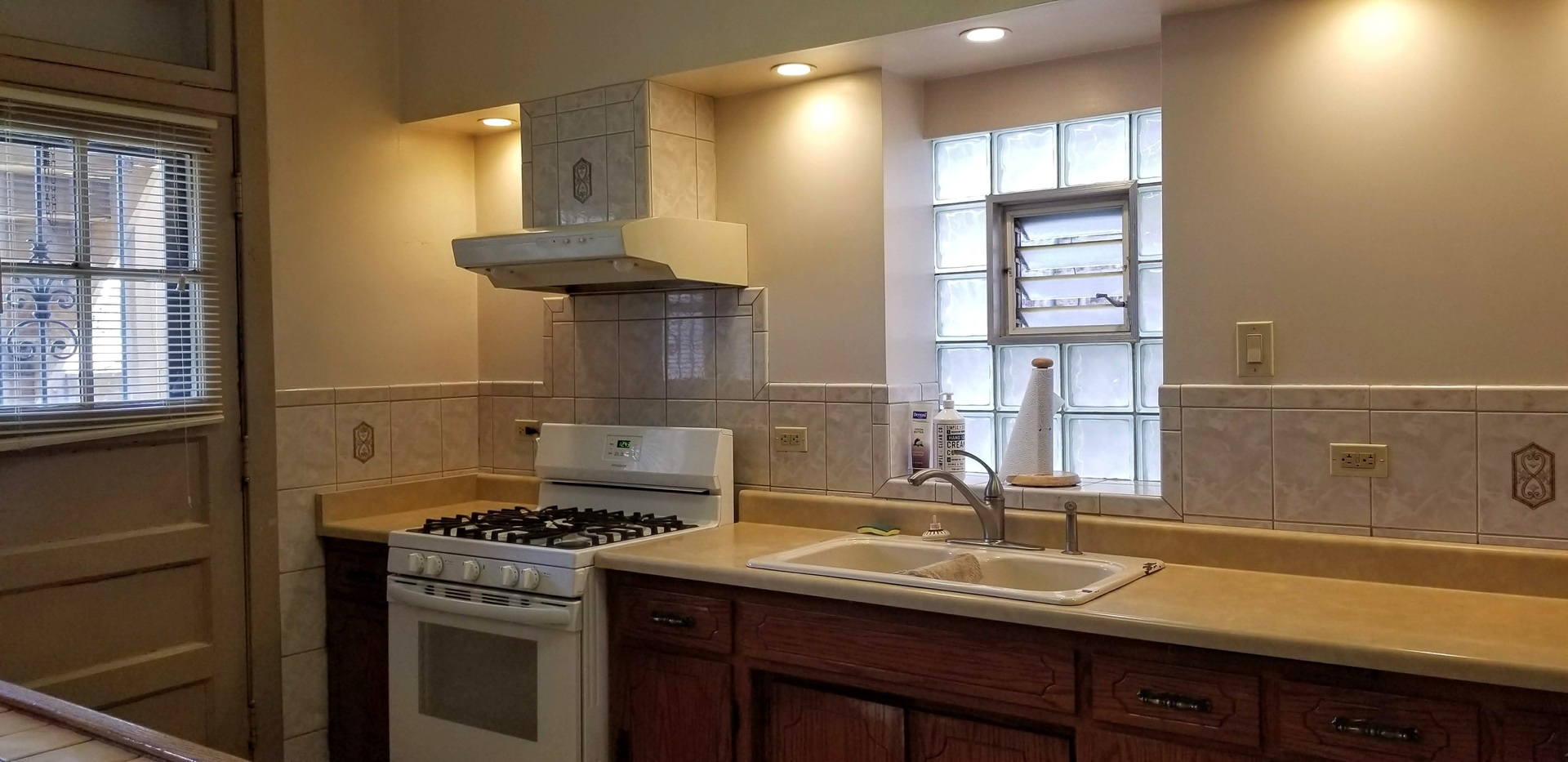7418 South Rhodes Avenue Chicago, IL 60619 - Photo 19 of 41 a kitchen with a sink and cabinets