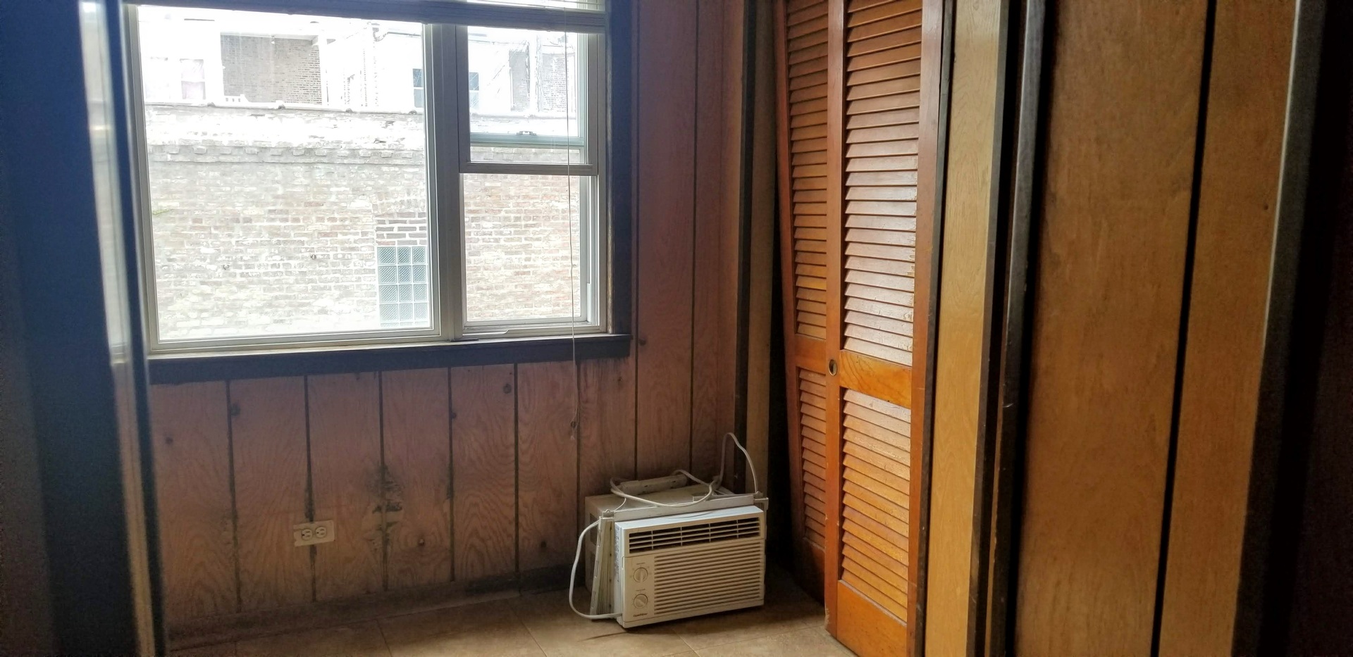 7418 South Rhodes Avenue Chicago, IL 60619 - Photo 21 of 41 a room with window and a door