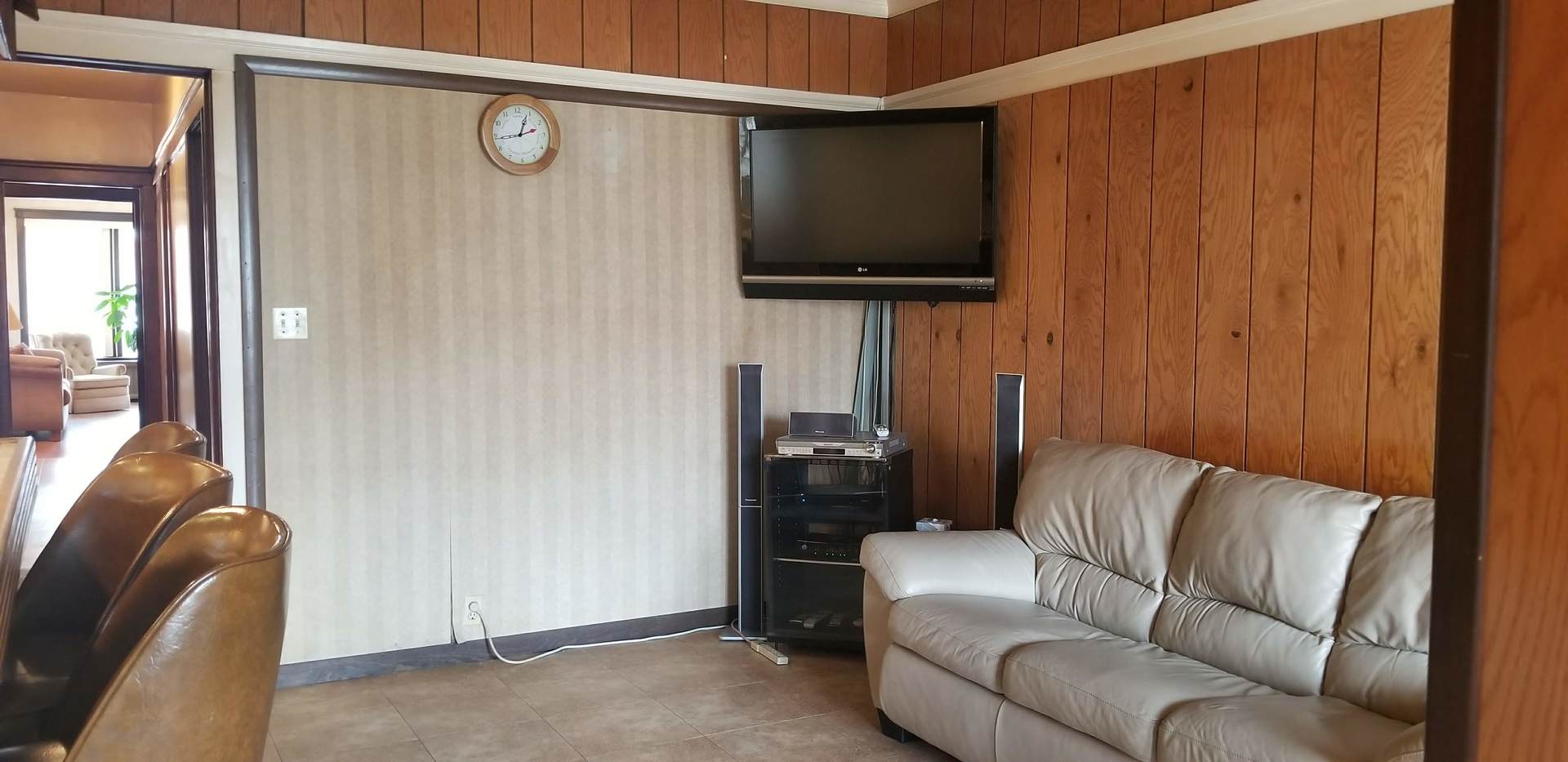 7418 South Rhodes Avenue Chicago, IL 60619 - Photo 22 of 41 a living room with furniture and a flat screen tv