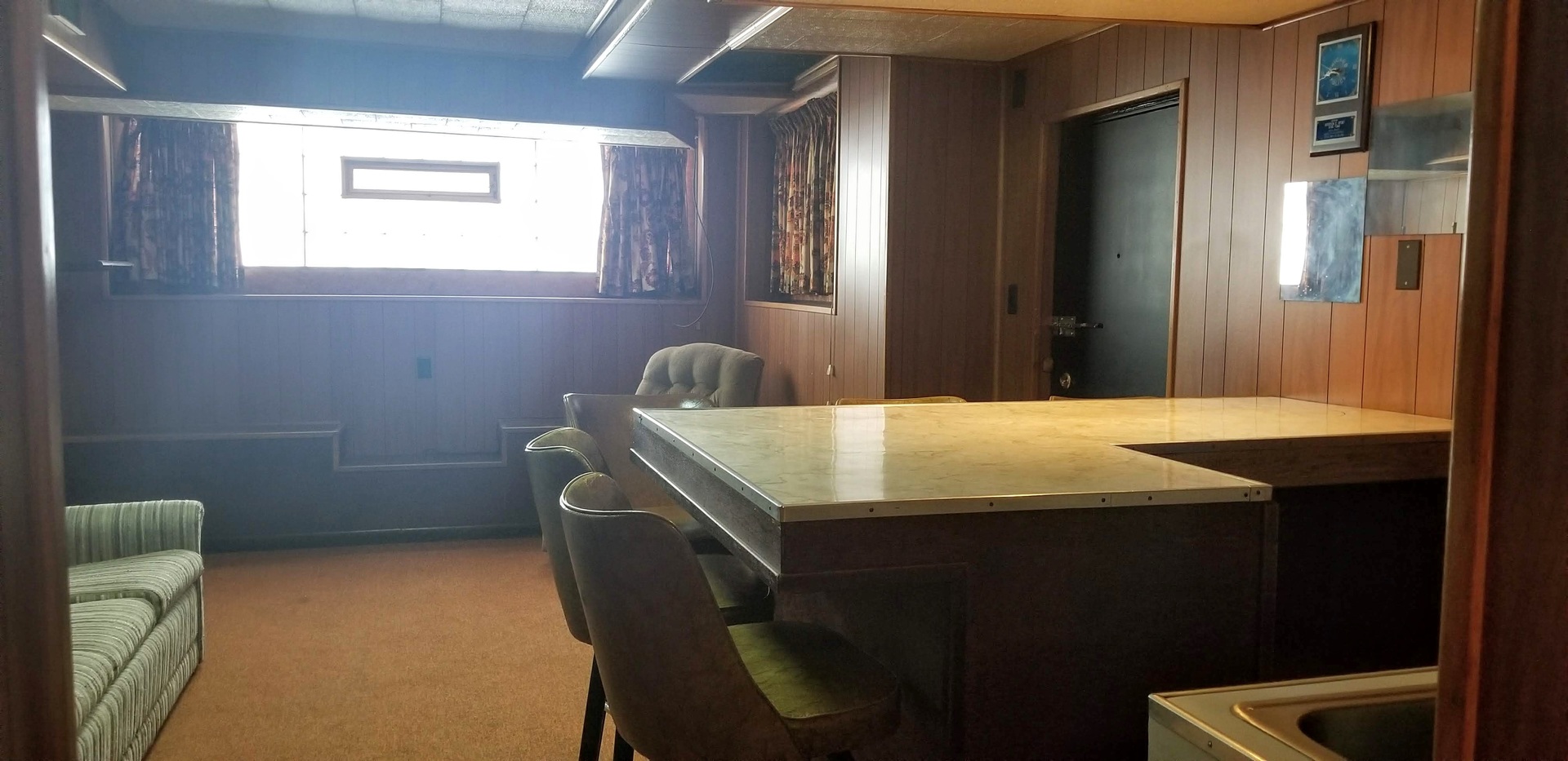 7418 South Rhodes Avenue Chicago, IL 60619 - Photo 26 of 41 a dining room with a table chairs and a window