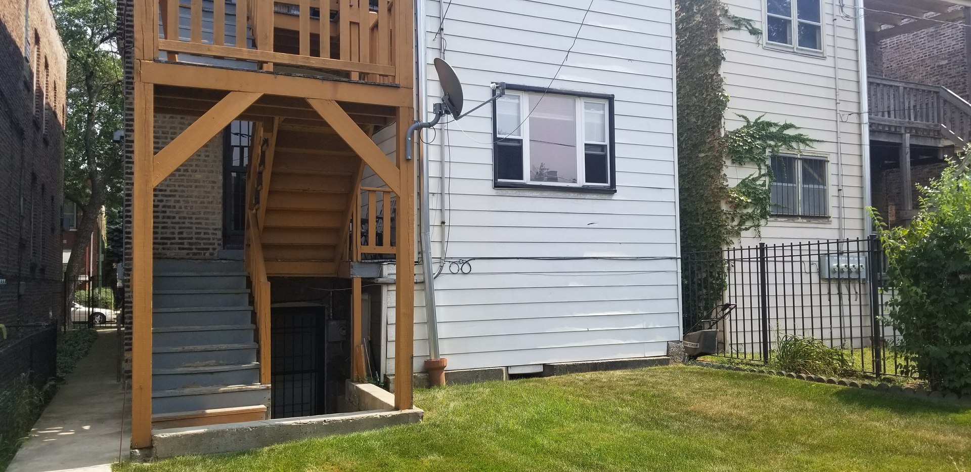 7418 South Rhodes Avenue Chicago, IL 60619 - Photo 38 of 41 a view of front door and yard