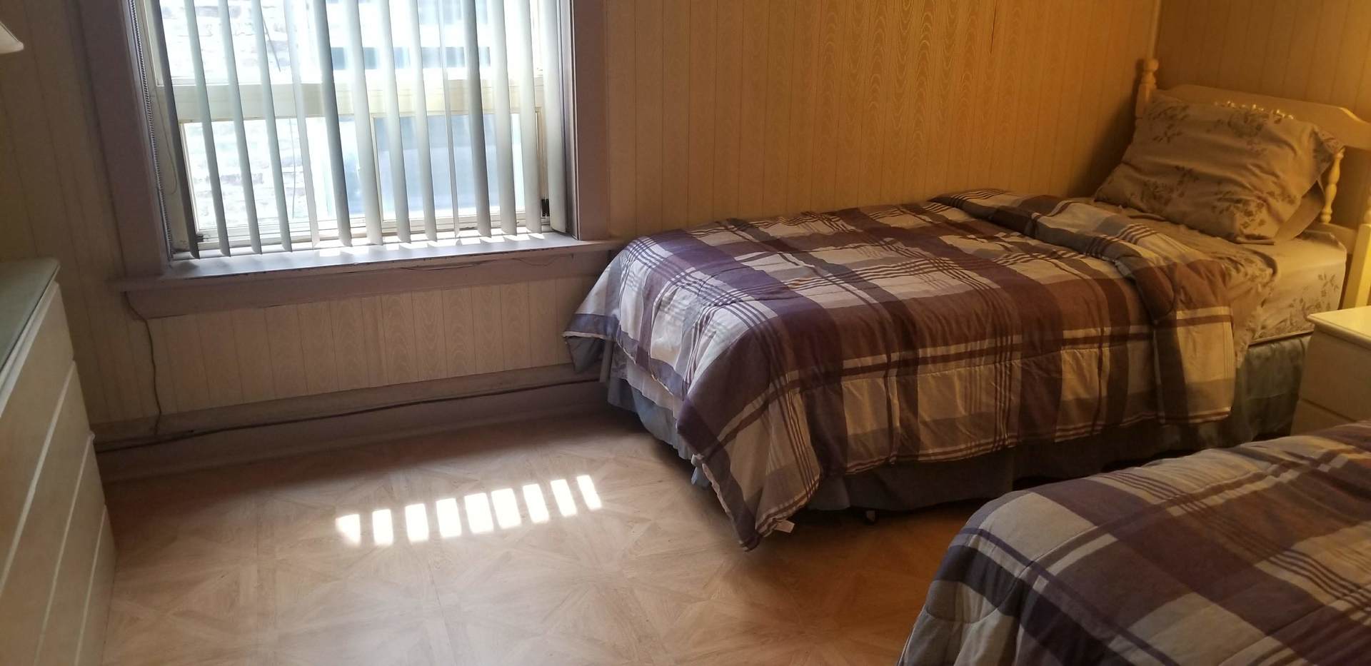 7418 South Rhodes Avenue Chicago, IL 60619 - Photo 10 of 41 a bedroom with a bed and a window