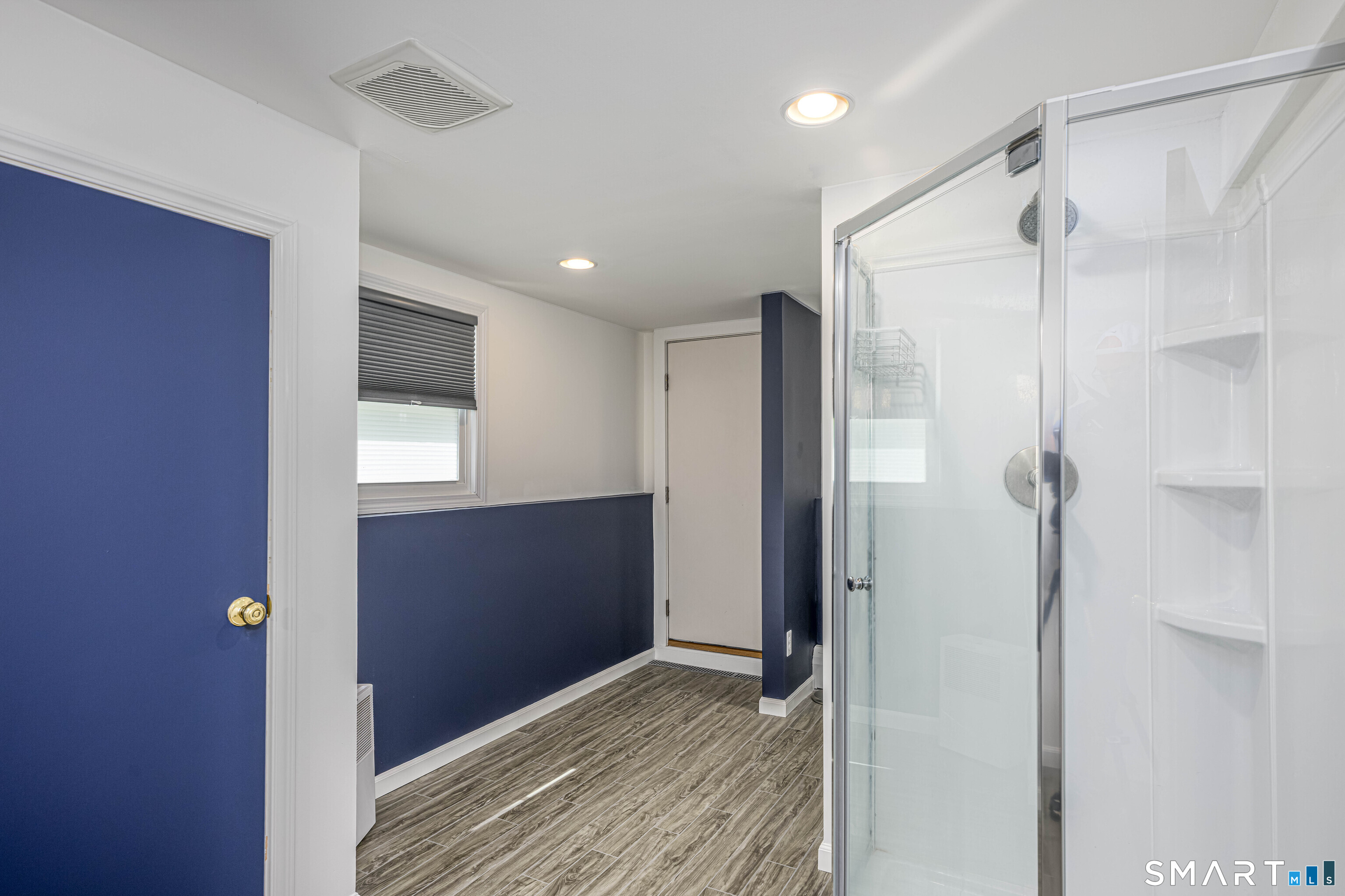 91 Nicholas Road Wallingford, CT 06492 - Photo 25 of 31 Lower-Level bathroom & walk-out basement door!
