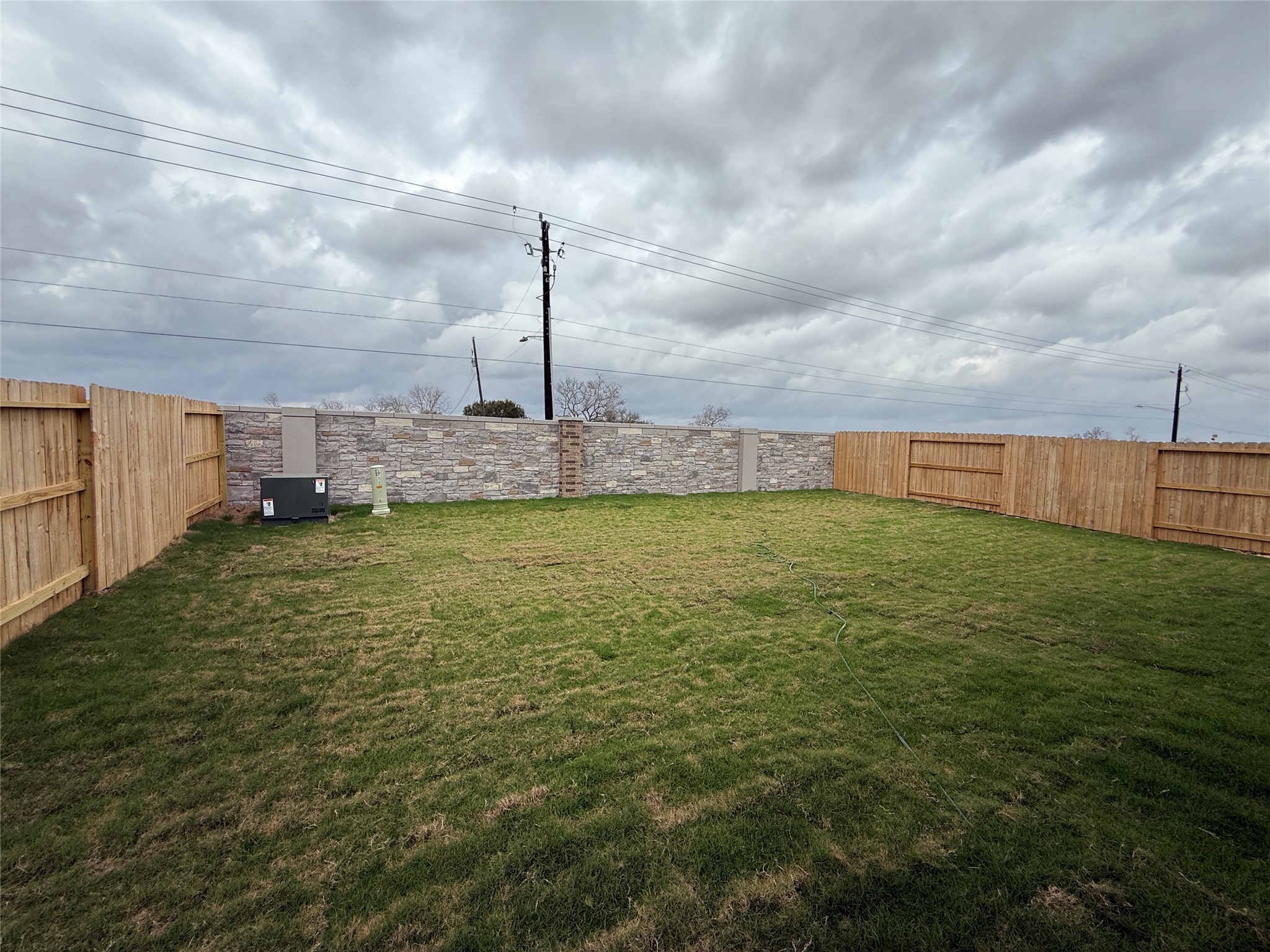 3130 Emerald Hills Drive Angleton, TX 77515 - Photo 15 of 17 a view of a fountain in front of a house