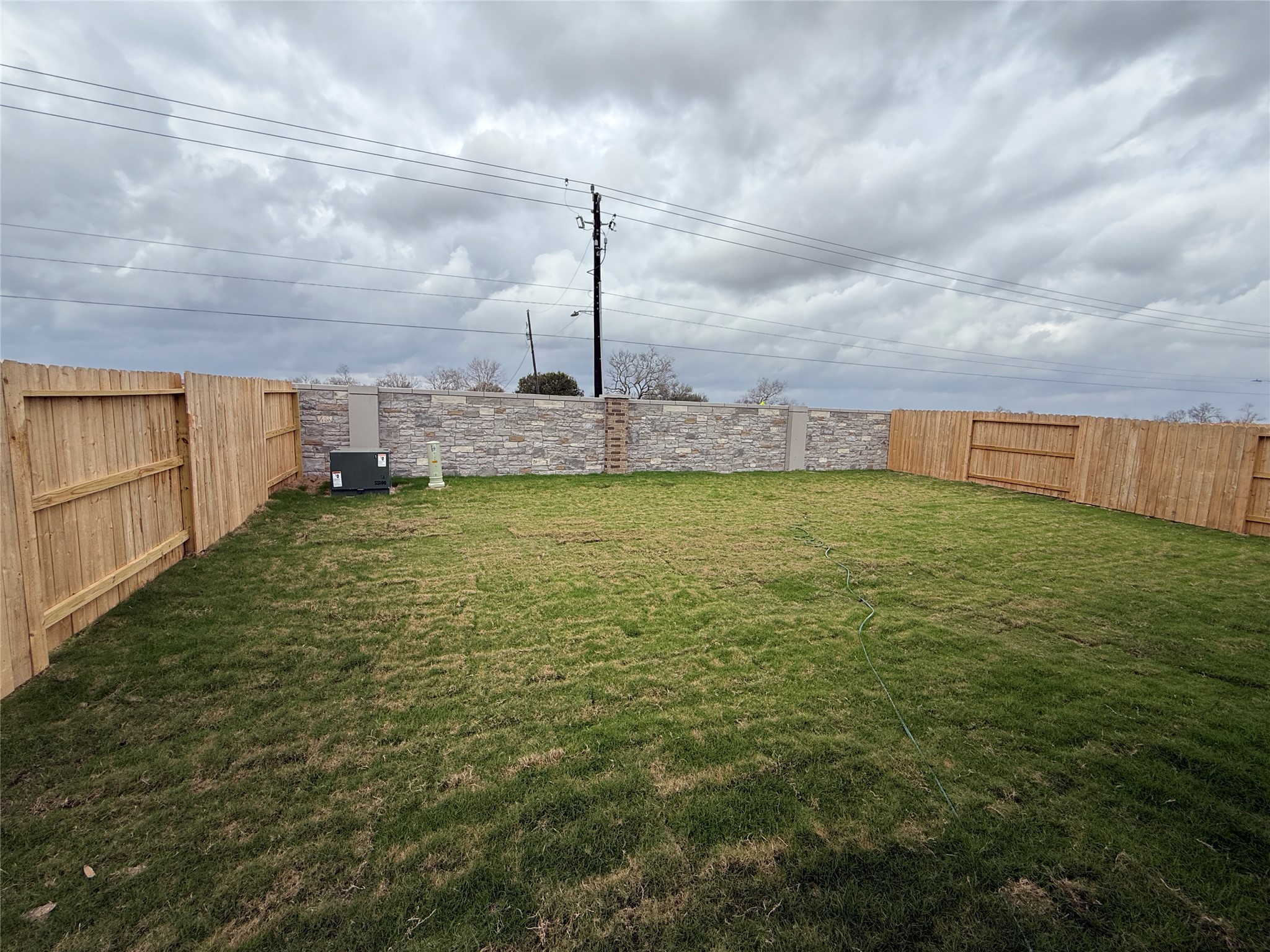 3130 Emerald Hills Drive Angleton, TX 77515 - Photo 16 of 17 a view of a swimming pool with a yard in front of it