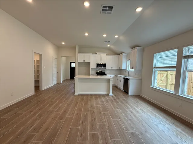 a view of kitchen with wooden floor
