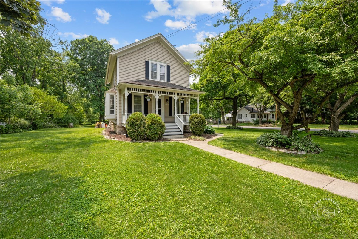 32W167 Army Trail Road Wayne, IL 60184 - Photo 1 of 19 a front view of house with yard and green space