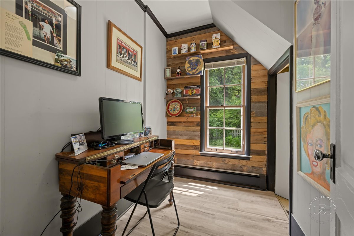 32W167 Army Trail Road Wayne, IL 60184 - Photo 11 of 19 a view of a workspace with furniture and a window