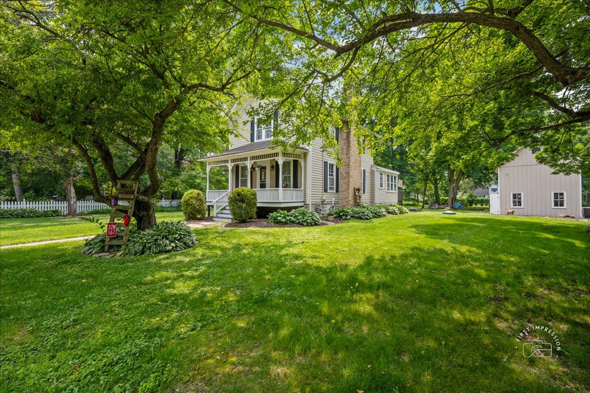 32W167 Army Trail Road Wayne, IL 60184 - Photo 2 of 19 a front view of house with yard and green space