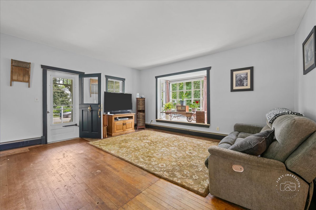32W167 Army Trail Road Wayne, IL 60184 - Photo 4 of 19 a living room with furniture and a flat screen tv