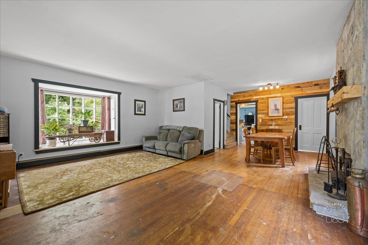32W167 Army Trail Road Wayne, IL 60184 - Photo 5 of 19 a living room with furniture and a large window