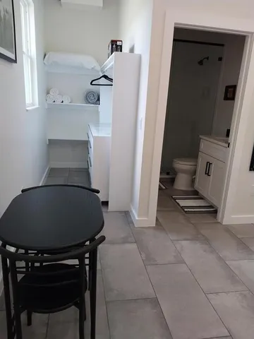 a hallway with washer and dryer