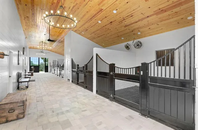 a lobby with furniture and a chandelier