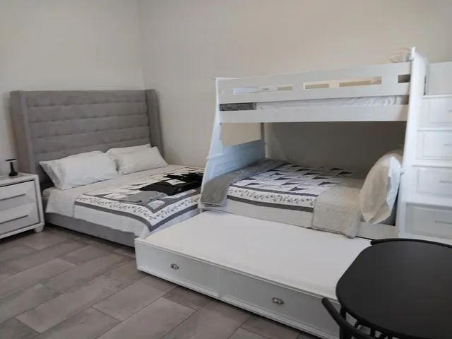 a kitchen with a refrigerator and a stove