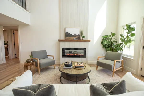 a living room with furniture and a fireplace