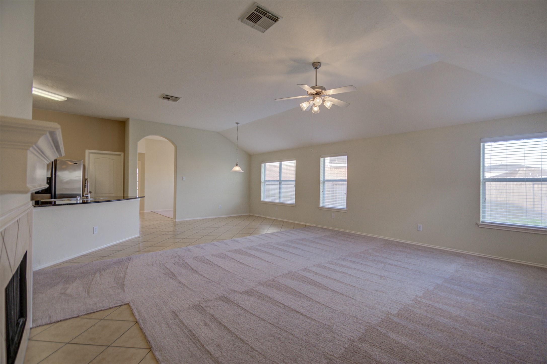 2406 Grove View Trail Fresno, TX 77545 - Photo 11 of 17 a view of empty room with wooden floor and fan
