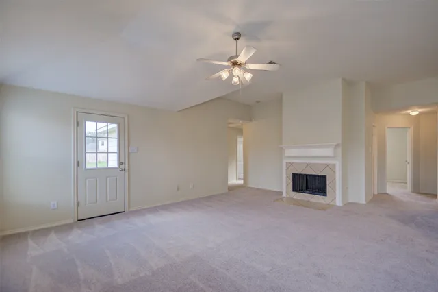 a view of empty room with fireplace