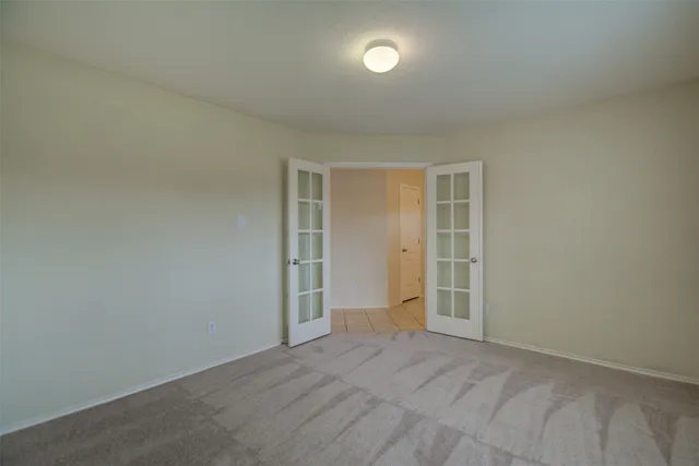 an empty room with closet area