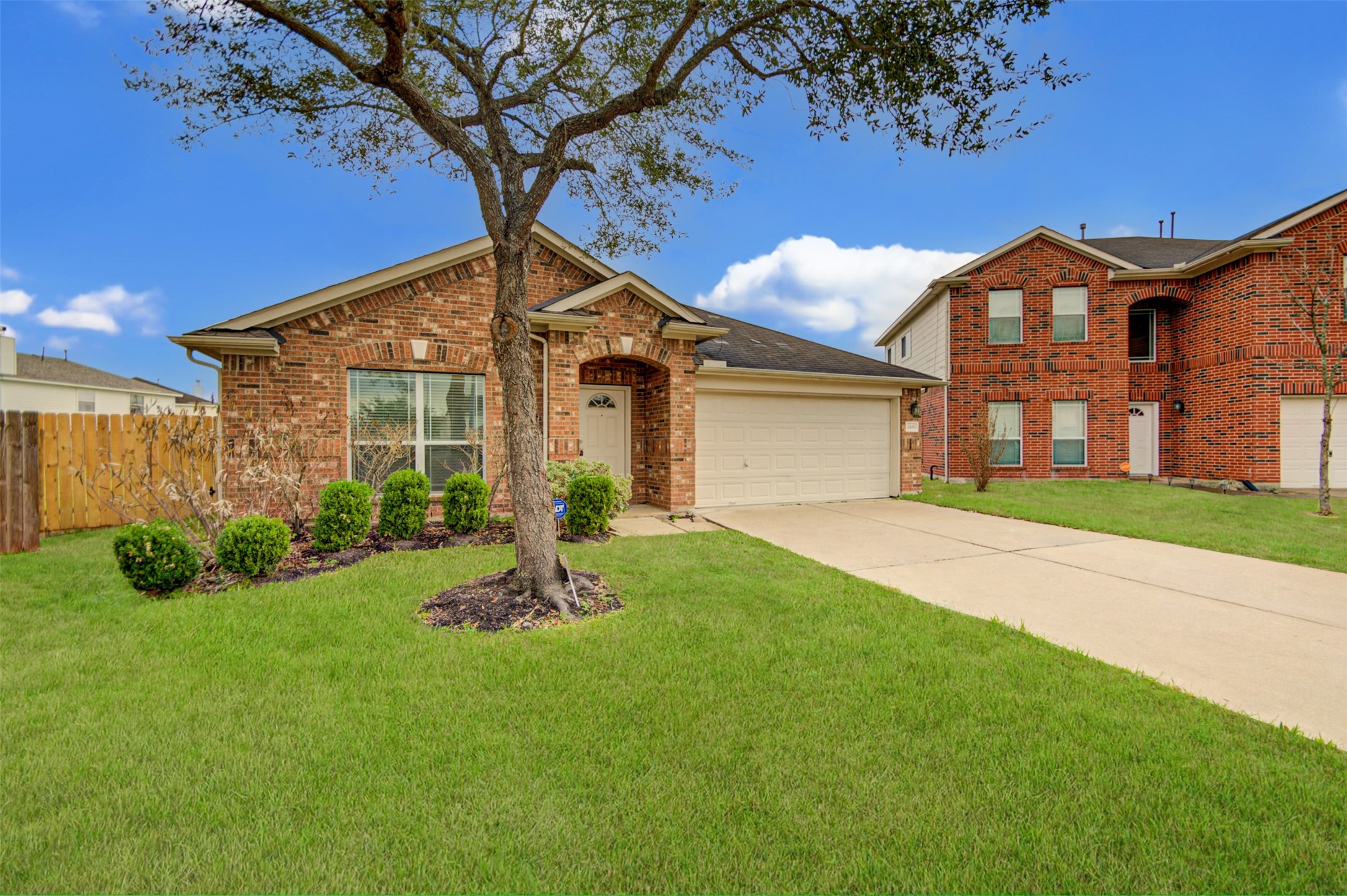 2406 Grove View Trail Fresno, TX 77545 - Photo 2 of 17 a front view of a house with garden