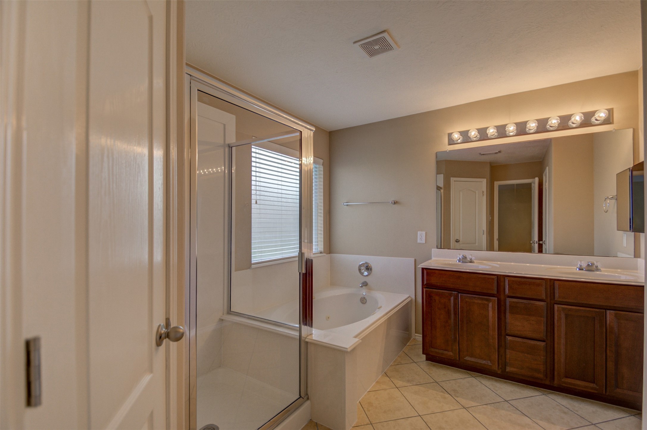 2406 Grove View Trail Fresno, TX 77545 - Photo 8 of 17 a bathroom with a tub sink and mirror