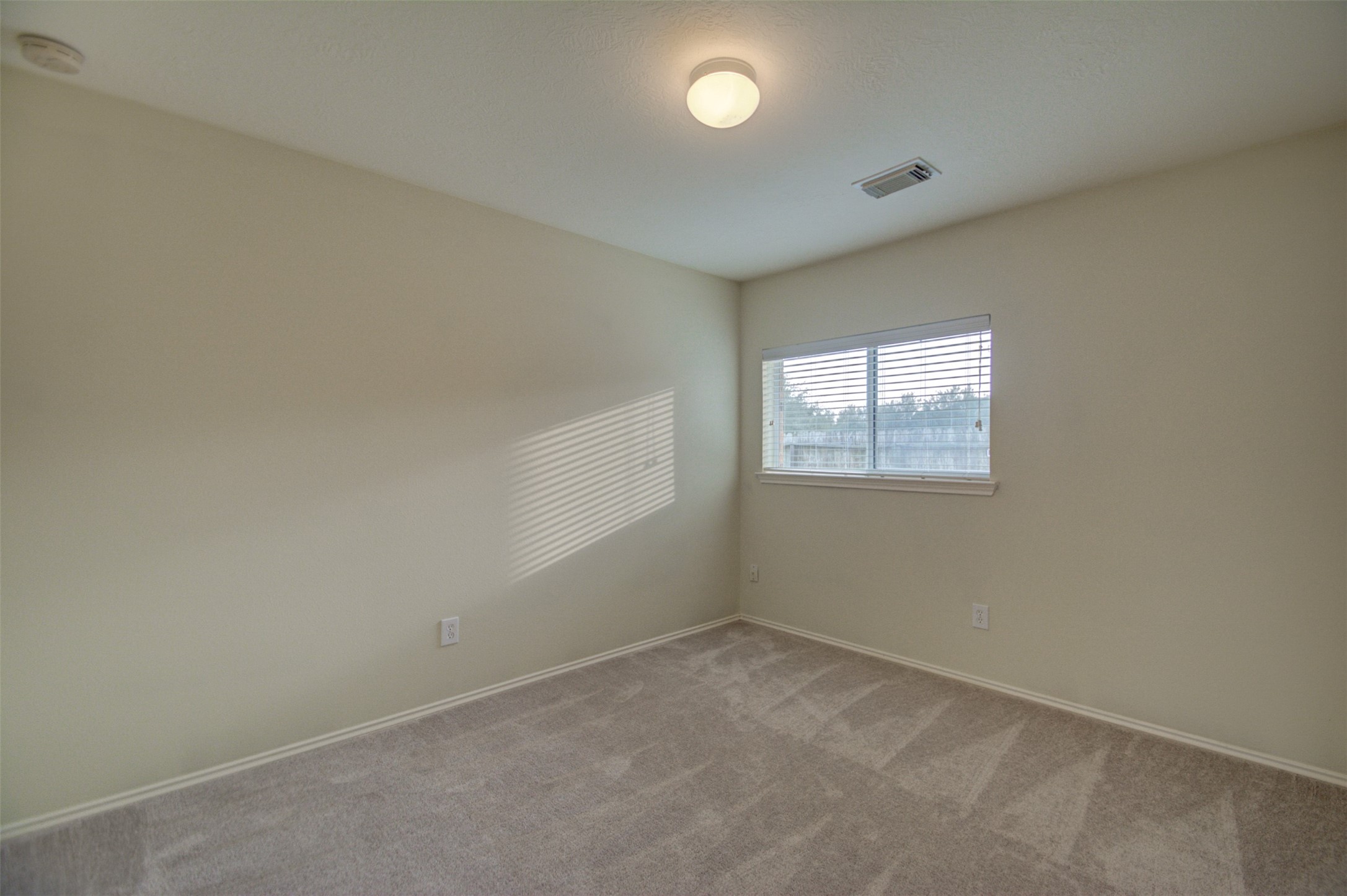 2406 Grove View Trail Fresno, TX 77545 - Photo 9 of 17 an empty room with a window