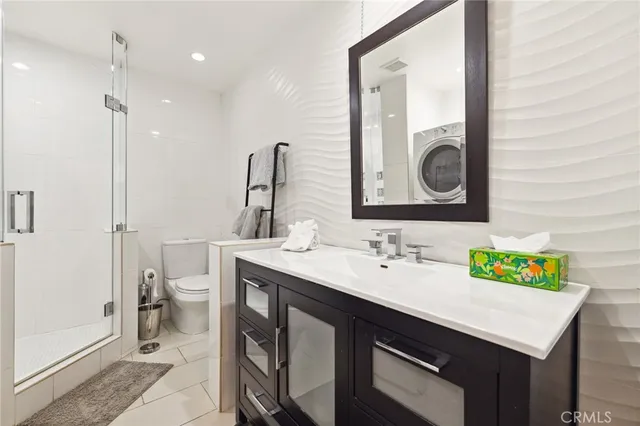 a bathroom with a sink vanity and a mirror