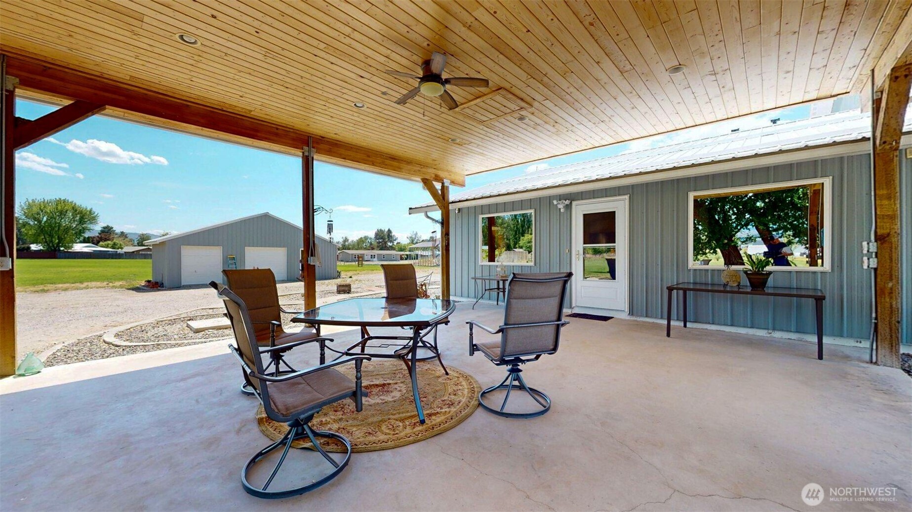46 Shumway Road Omak, WA 98841 - Photo 24 of 40 a view of a patio with table and chairs