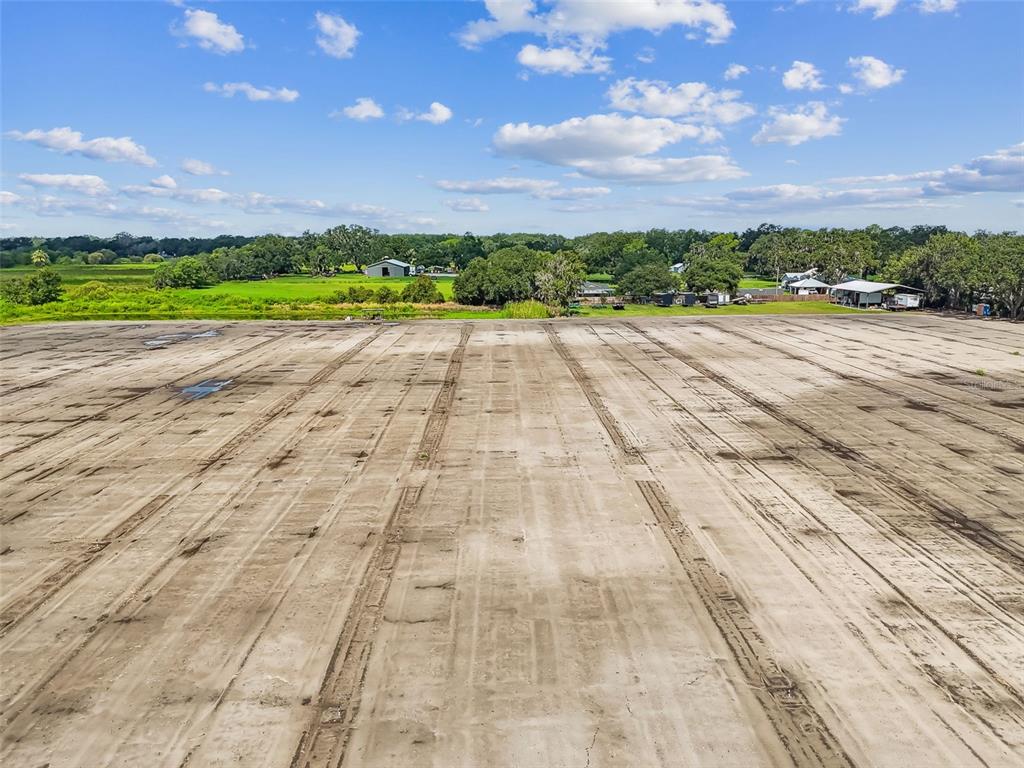 1715 West Sam Allen Road Plant City, FL 33565 - Photo 30 of 54 a view of big yard with wooden fence
