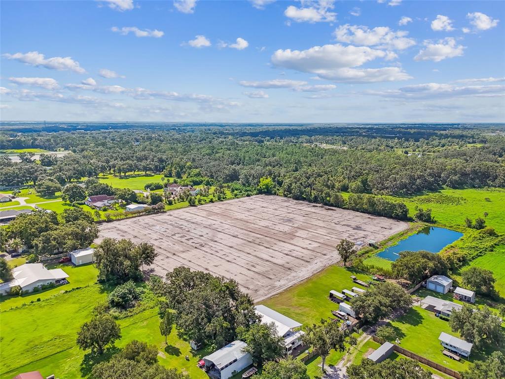 1715 West Sam Allen Road Plant City, FL 33565 - Photo 3 of 54 a view of a lake with a yard