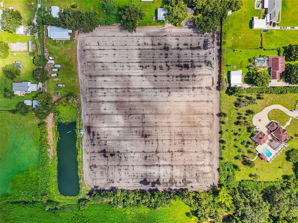 1715 West Sam Allen Road Plant City, FL 33565 - Photo 41 of 54 a brick building with a yard