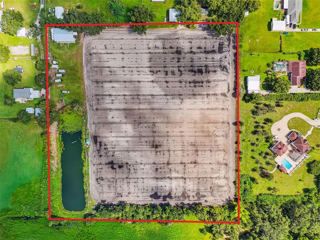 1715 West Sam Allen Road Plant City, FL 33565 - Photo 42 of 54 a brick building with a yard