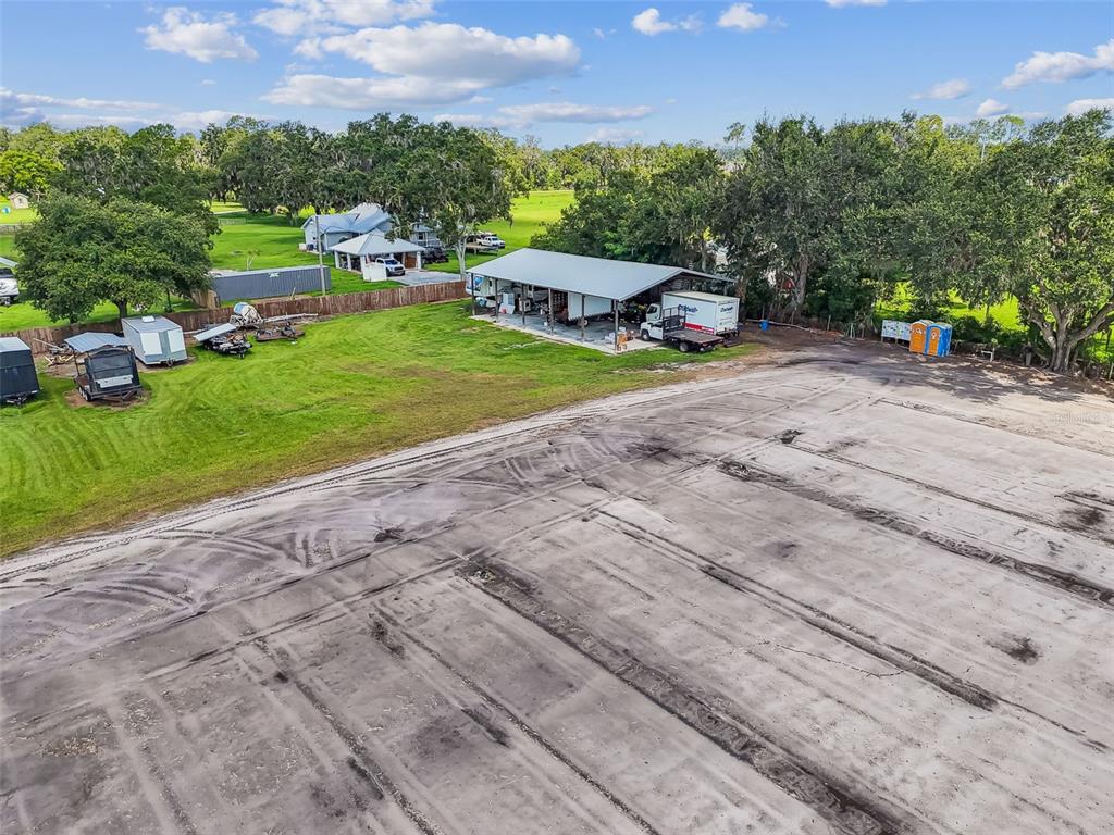 1715 West Sam Allen Road Plant City, FL 33565 - Photo 43 of 54 a view of a house with a yard
