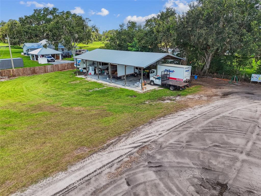 1715 West Sam Allen Road Plant City, FL 33565 - Photo 45 of 54 a view of a table and chairs in patio