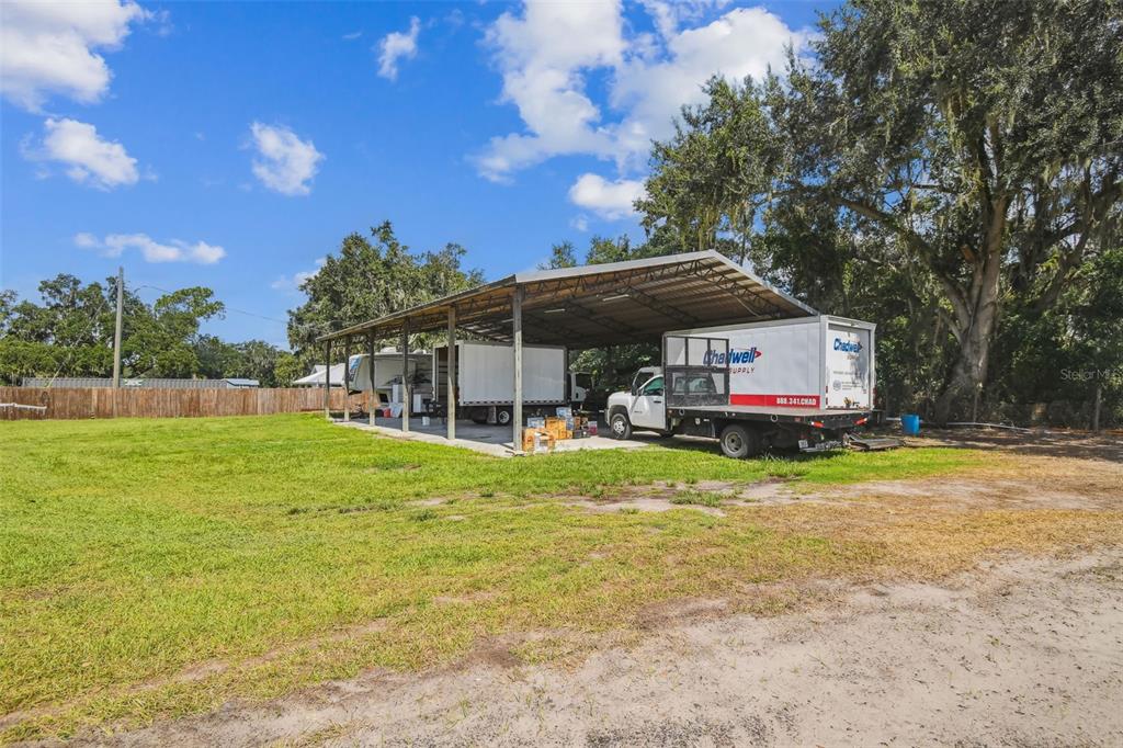 1715 West Sam Allen Road Plant City, FL 33565 - Photo 51 of 54 a front view of a house with garden