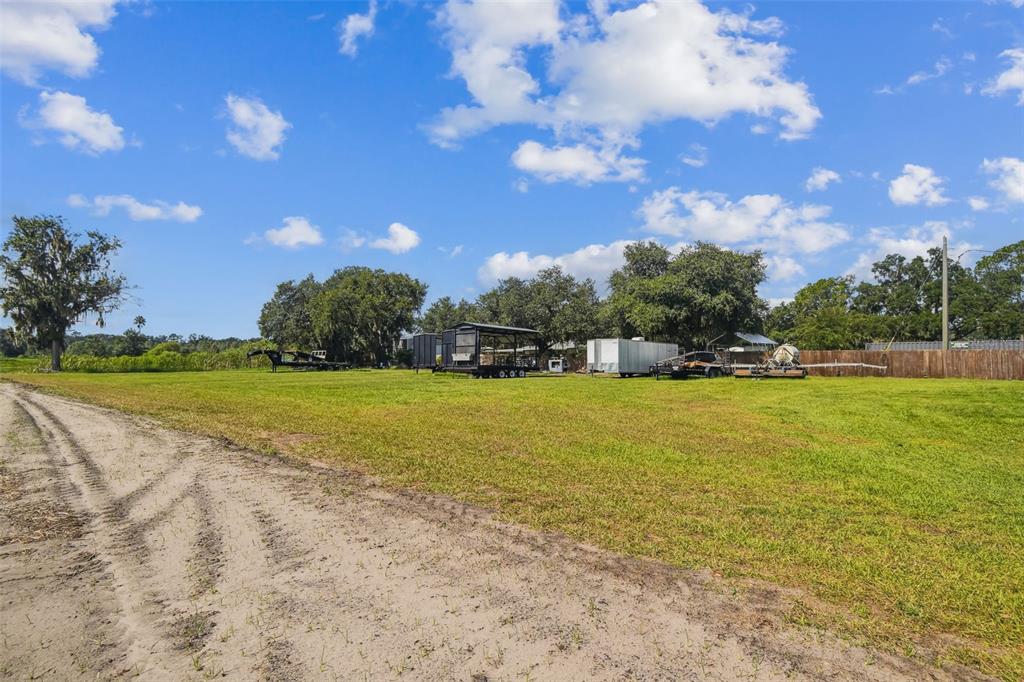 1715 West Sam Allen Road Plant City, FL 33565 - Photo 52 of 54 a view of yard with swimming pool and green space