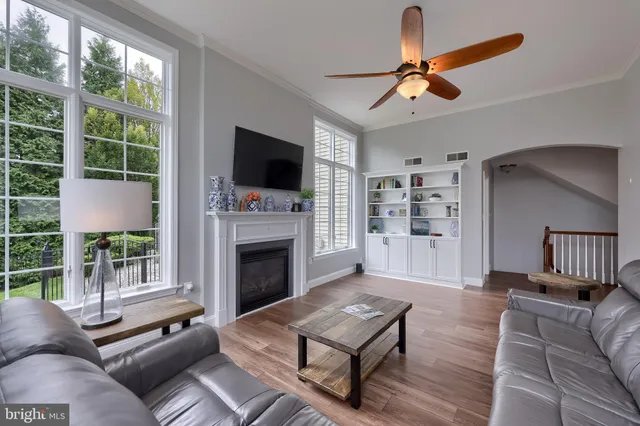 a living room with furniture and a piano