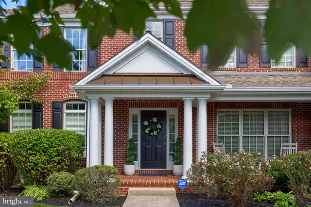 front view of a house with a small yard