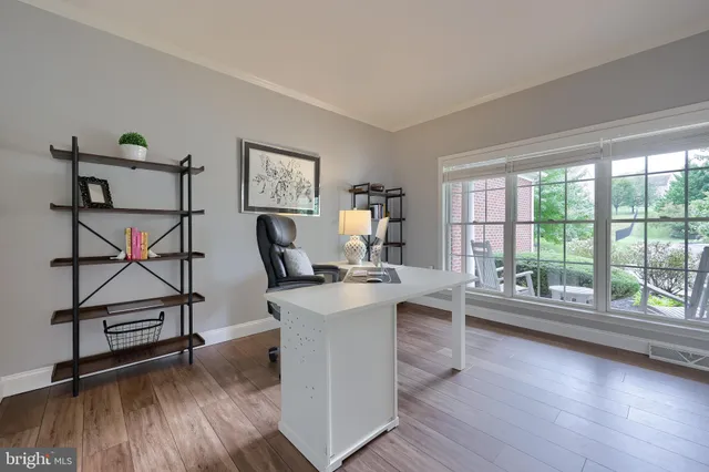 a living room with furniture and windows