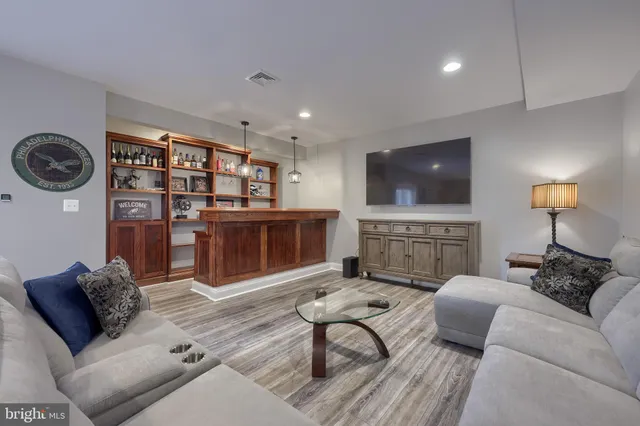 a bedroom with furniture and a book shelf