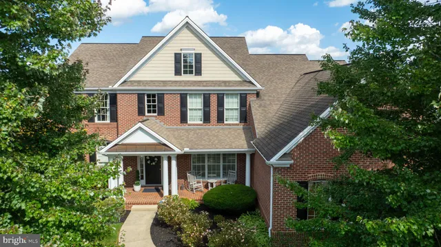 a view of a house with a yard and garage