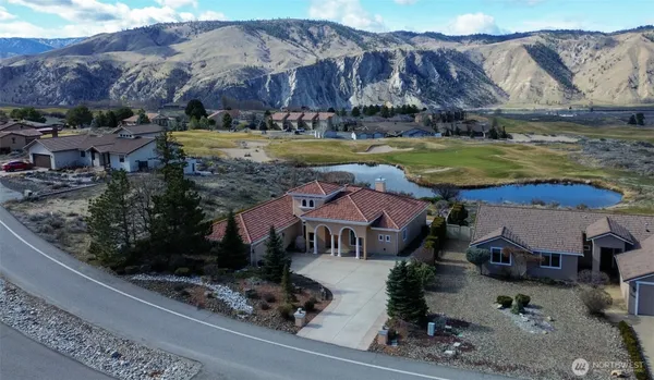 an aerial view of residential houses and outdoor space