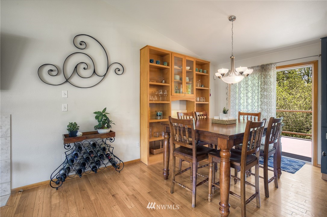 201 Morgan Road Everett, WA 98203 - Photo 13 of 29 a view of a dining room with furniture window and wooden floor