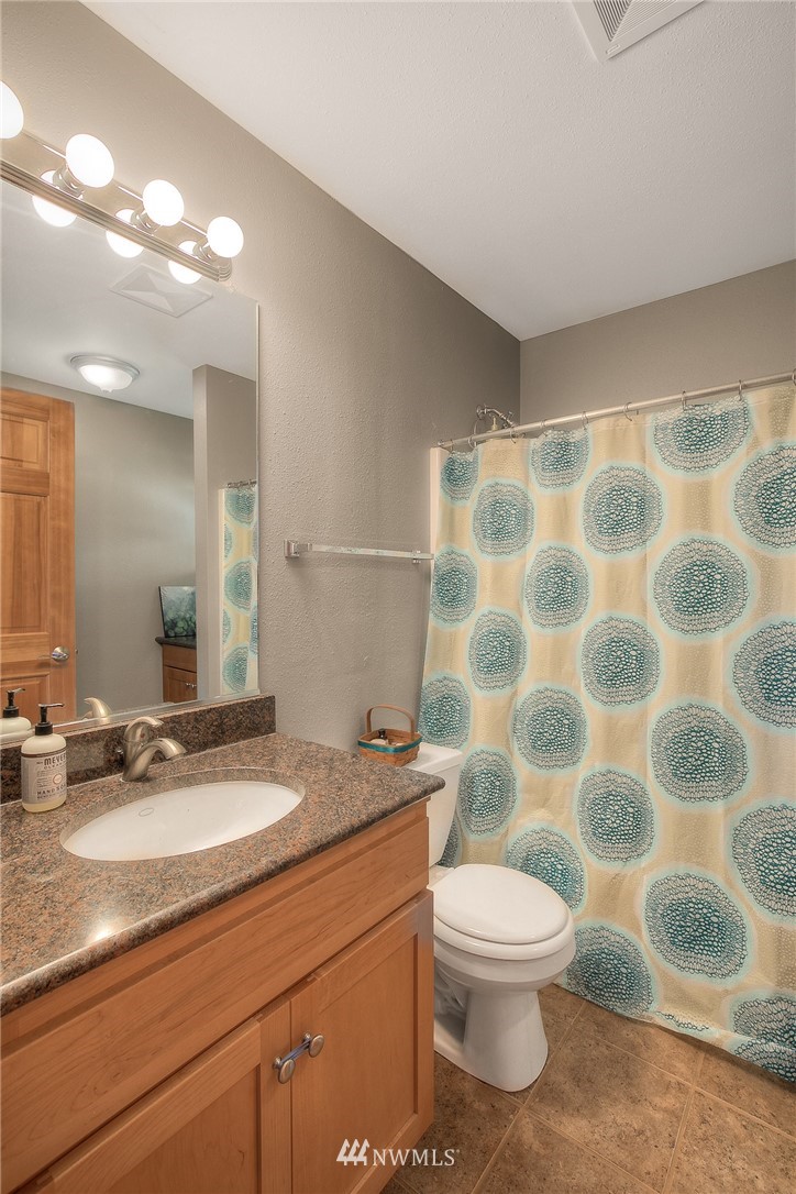 201 Morgan Road Everett, WA 98203 - Photo 21 of 29 a bathroom with a sink and a mirror