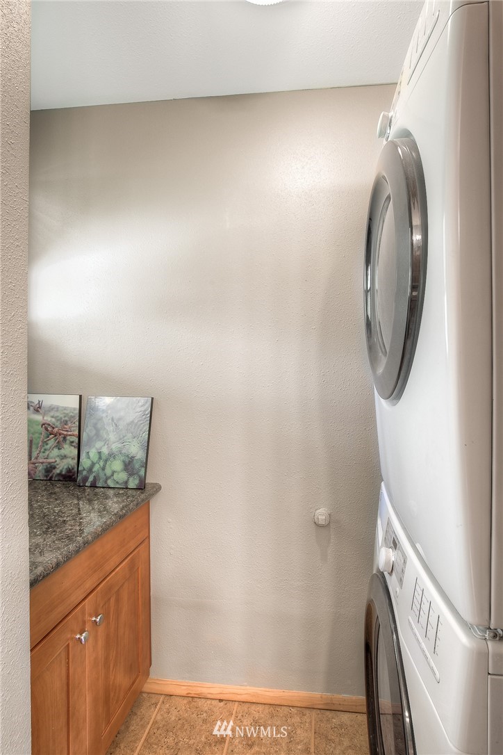201 Morgan Road Everett, WA 98203 - Photo 22 of 29 a bathroom with a granite countertop sink and a mirror