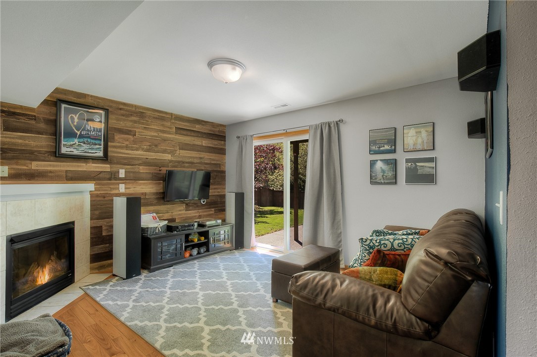 201 Morgan Road Everett, WA 98203 - Photo 24 of 29 a living room with furniture and a fireplace