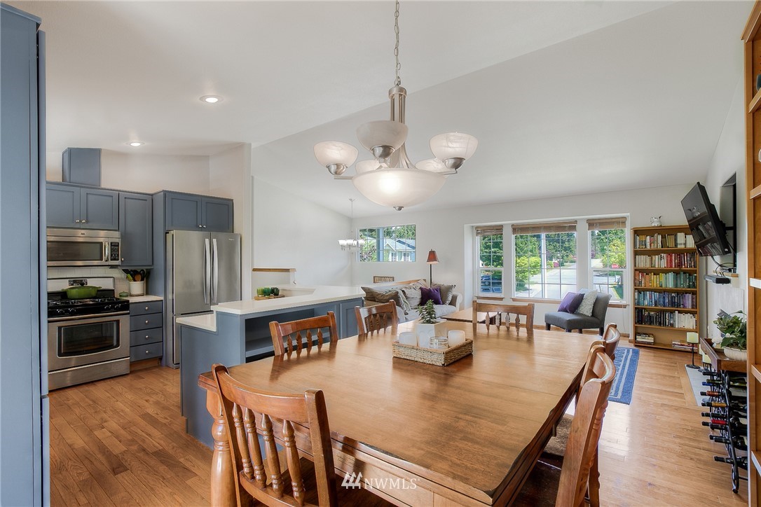 201 Morgan Road Everett, WA 98203 - Photo 7 of 29 a large kitchen with a table and chairs
