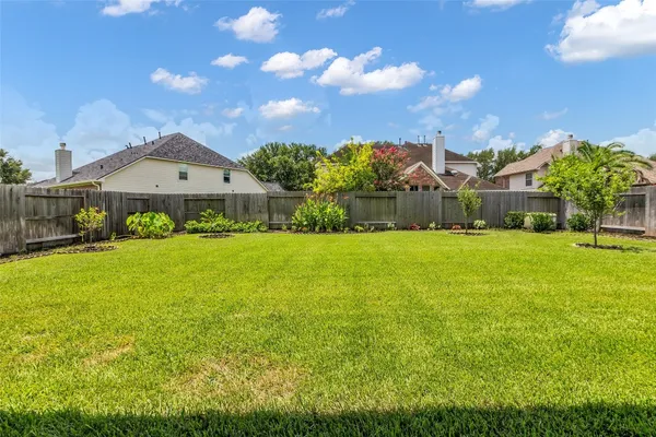 a view of a house with a big yard